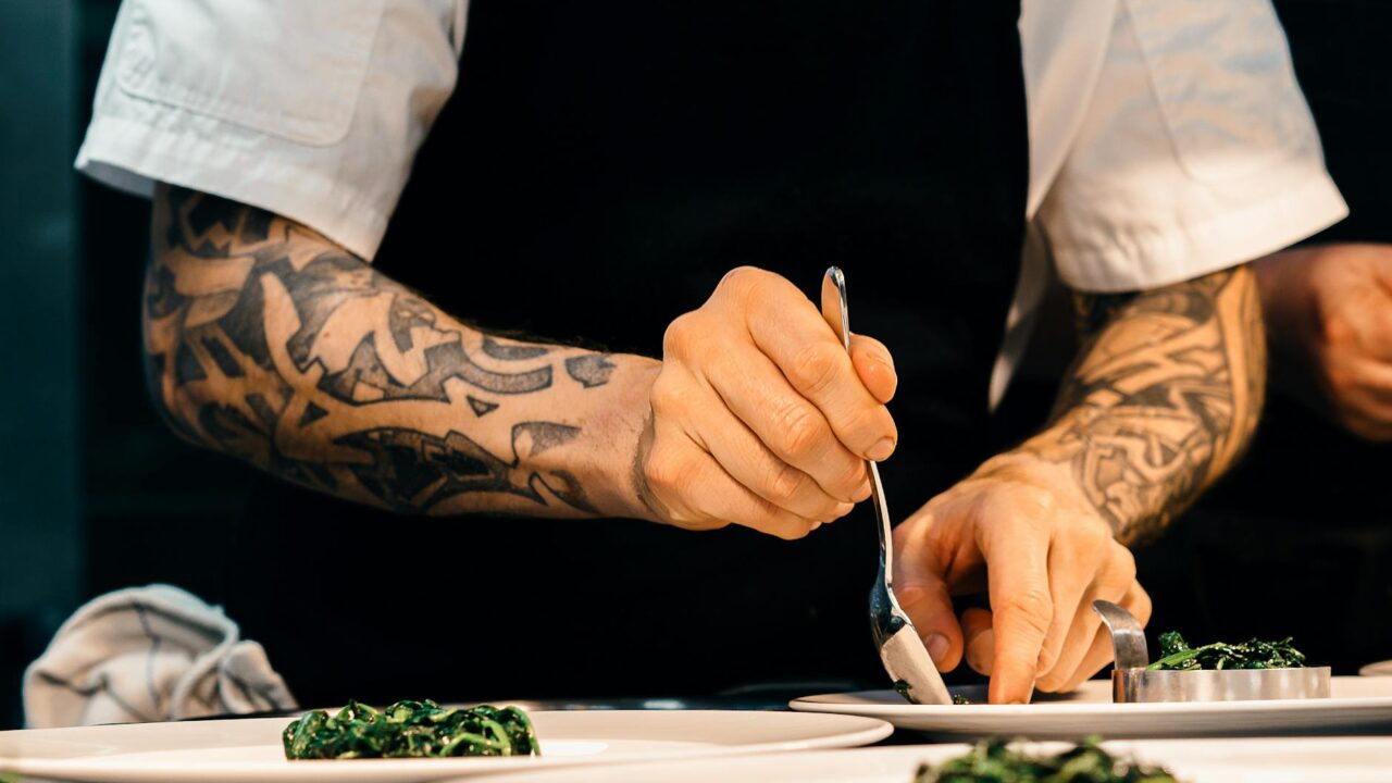 person holding silver spoon