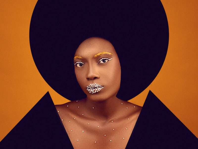 collage of a portrait of a woman in creative makeup and black geometric elements