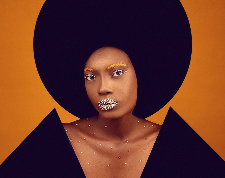 collage of a portrait of a woman in creative makeup and black geometric elements